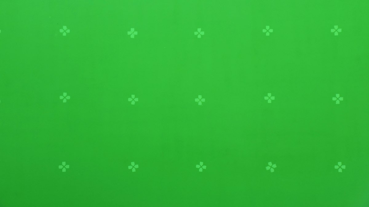 Parede de chroma key verde com marcadores de rastreamento em estúdio de cinema
